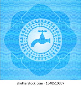 tap icon inside light blue water emblem background.