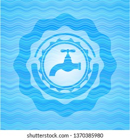 tap icon inside light blue water style emblem.