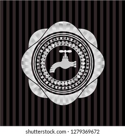 tap icon inside silver emblem