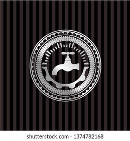 tap icon inside silver emblem or badge