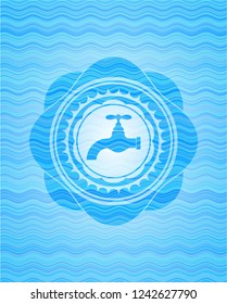 tap icon inside sky blue water wave style emblem.