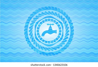 tap icon inside sky blue water emblem background.