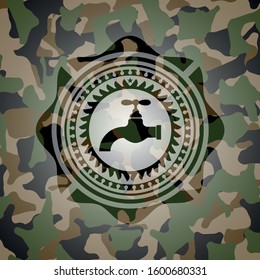 tap icon on camouflage texture