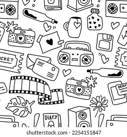 Tape recorder, camera, camera film and other memory elements in seamless pattern. Print for textile, wallpaper, covers, surface. For fashion fabric. Doodle style