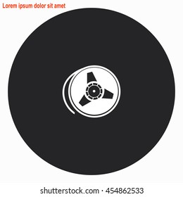 Tape reel web icon. Gray circle button with white illustration.