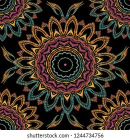 Tapestry floral abstract vector seamless mandala pattern. Ornamental colorful textured background. Decorative embroidered ethnic flowers  ornament. Repeat grunge backdrop. Embroidered patterned design