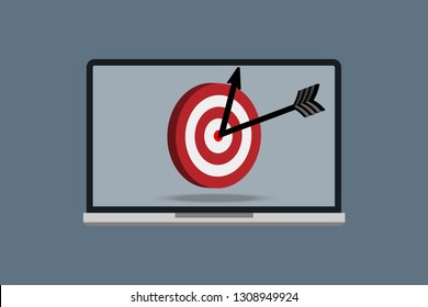 Target with arrow in centre of laptop screen. 