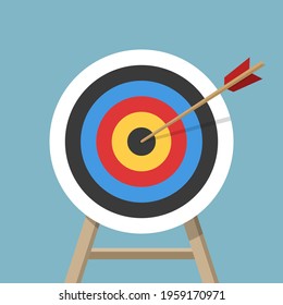 Target with an arrow, standing on a tripod. Archery or business goal concept. Vector illustration isolated on colored background