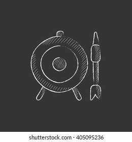 Target board and arrow. Drawn in chalk icon.