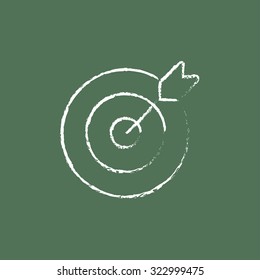 Target board and arrow hand drawn in chalk on a blackboard vector white icon isolated on a green background.