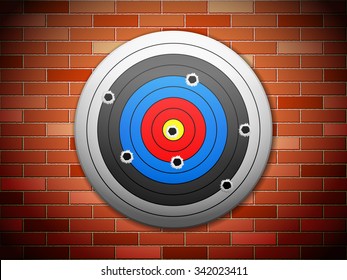 Target with bullet holes on brick wall background.