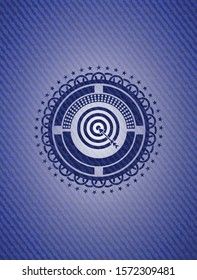 target, business icon inside badge with denim background