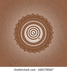 target, business icon inside badge with wooden background
