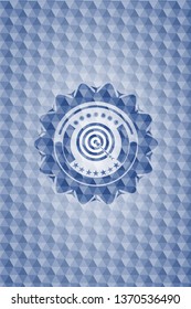 target, business icon inside blue emblem or badge with abstract geometric polygonal pattern background.