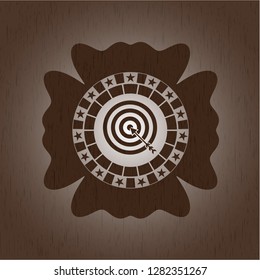 target, business icon inside wooden emblem. Vintage.