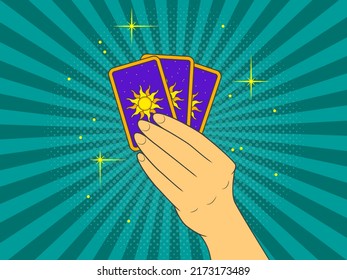 Tarot cards in hand. Pop art vector illustration