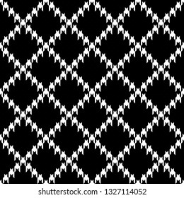 Tartan check plaid pattern vector in black & white. Striped houndstooth tweed texture. White stripes on black background. Seamless tile for autumn / winter fabric design.
