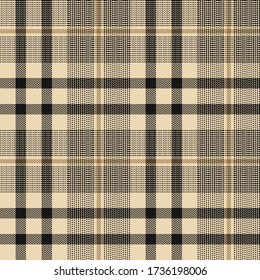 Tartan plaid pattern background. Seamless herringbone check plaid graphic in black and gold for jacket, skirt, trousers, blanket, throw, or other modern autumn winter fabric design.