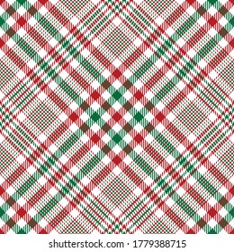 Tartan plaid pattern in green, red, white. Seamless Christmas and New Year glen fabric texture for tablecloth, skirt, or other modern winter holiday tweed textile print.