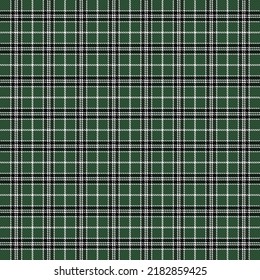 Tartan plaid. Patrón escocés en jaula negra, verde y blanca. Jaula escocesa. Fondo tradicional escocés a cuadros. Textura de tela sin fisuras. Ilustración del vector