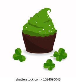 Tasty cupcake and clover, isolated on white. Saint Patrick's Day design elements