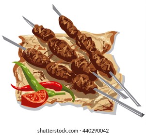 tasty kebabs on skewers with pita bread, tomato and chilly peppers