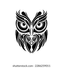 ﻿A tat of an owl done in black-and-white, with Polynesian designs.