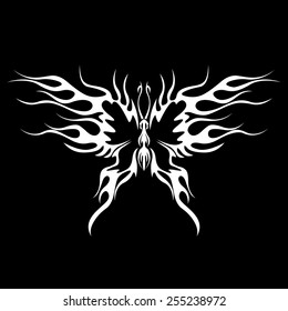 A tattoo with abstract flaming butterfly on the black background.