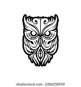 ﻿Owl tattoo with black and white color and Polynesian inspired design.
