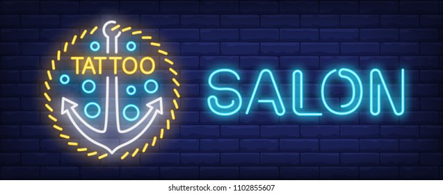 Tattoo salon neon sign. Nautical anchor on golden chain. Vector illustration in neon style for tattoo studio signboard