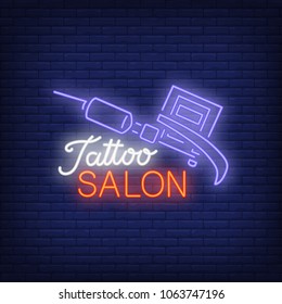 Tattoo salon neon text with tattoo machine. Neon sign, night bright advertisement, colorful signboard, light banner. Vector illustration in neon style.