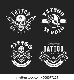 Tattoo studio emblems set. Hand holding tattoo machine. Human skulls outline drawing. Tattoo shop advertising. Vector vintage illustration.