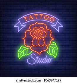 Tattoo studio neon sign with rose. Night bright advertisement, colorful signboard, light banner. Vector illustration in neon style.