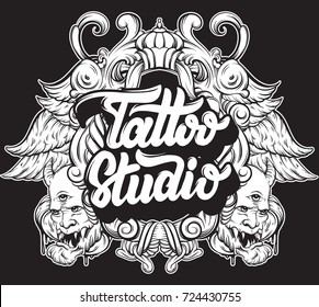 Tattoo Studio. Vector handwritten trendy lettering with hand drawn illustration of daemons, baroque frame, wings. Template for card, poster, banner, label, print for t-shirt, logo design.