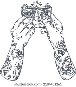 tattooed hands toast to a delicious drink filled with scorpions