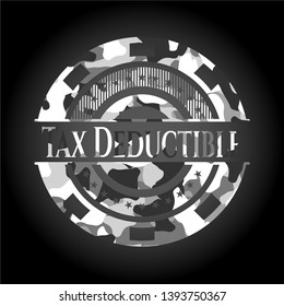 Tax Deductible on grey camouflaged texture