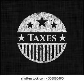 Taxes chalk emblem written on a blackboard