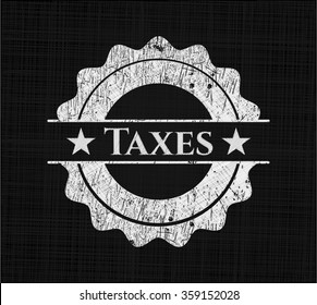 Taxes chalkboard emblem on black board