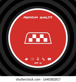 Taxi sign on taxi roof. Chequered pattern as a distinctive sign on a taxi