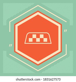 Taxi sign on taxi roof. Chequered pattern as a distinctive sign on a taxi