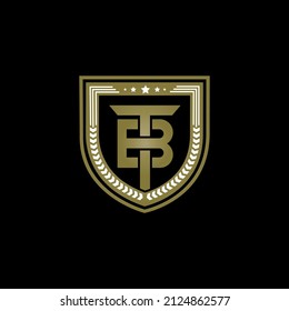 Letra TB Monograma con forma de escudo diseño de color dorado aislado. 