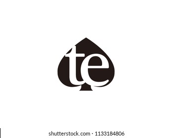 The te initials logo inside the black shovel