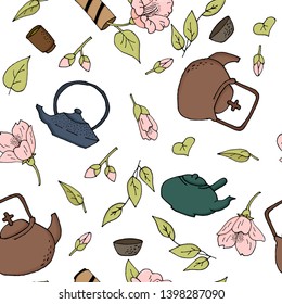 Tea background with teapots and comel flower. Japanese teapots and pink flowers