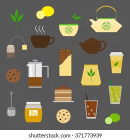 Tea bag, cup, pot, cake, strainer, honey, lemon, lime, cookies, chinese teapot isolated on the blackboard.