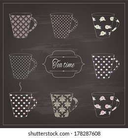  Tea cups drawn by colored chalk on retro chalkboard background.