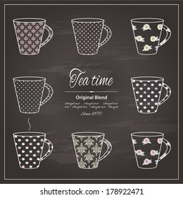 Tea cups drawn by colored chalk on retro chalkboard background.