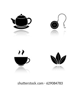Tea drop shadow black icons set. Steaming cup, teapot on plate, loose tea leaves and ball infuser. Isolated vector illustrations
