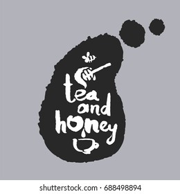 Tea and Honey. Hand written calligraphy phrase in a speech bubble. White on black. Clipping paths included.