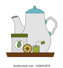 tea pot lemon and tea bag container on tray