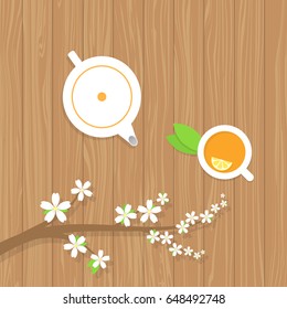 Tea teapot and a branch of the cherry blossoms on a wooden table. Vector illustration .
